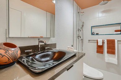 Inspiration for a small southwestern master white tile and porcelain tile marble floor, multicolored floor and single-sink bathroom remodel in Denver with flat-panel cabinets, white cabinets, a bidet, white walls, a drop-in sink, quartz countertops, brown countertops, a niche and a floating vanity