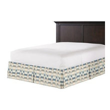 Bedding, bedskirt, pillows, headboard.