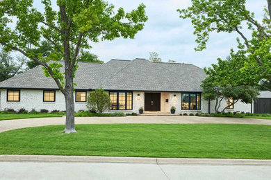 Huge contemporary multicolored one-story brick house exterior idea in Dallas with a shingle roof and a gray roof