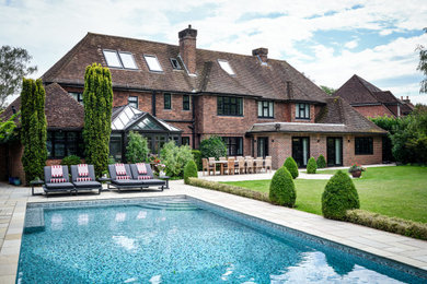 Design ideas for a classic swimming pool in Surrey.