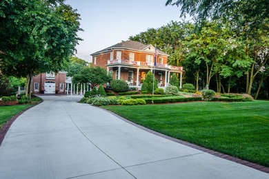 Inspiration for a timeless backyard concrete paver patio remodel in Kansas City
