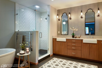 Example of a mid-sized porcelain tile and black floor enclosed kitchen design in Seattle with a farmhouse sink, flat-panel cabinets, medium tone wood cabinets, quartz countertops and stone slab backsplash