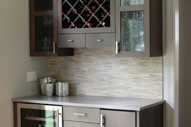 Example of a transitional home bar design in New York