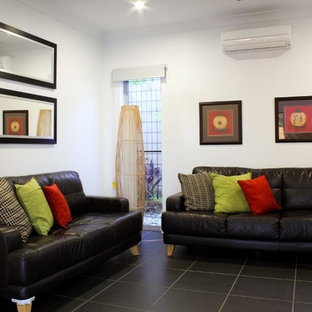 Mid-sized coastal enclosed home theater photo in Cairns