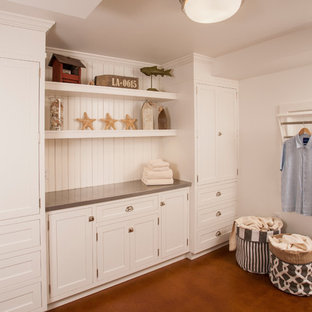 Medium sized traditional separated utility room in Seattle with shaker cabinets, white cabinets, zinc worktops, white walls, concrete flooring and a side by side washer and dryer.