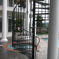 s058 Spiral Staircase with custom landing from Deck to patio in Forest, Virginia - Products