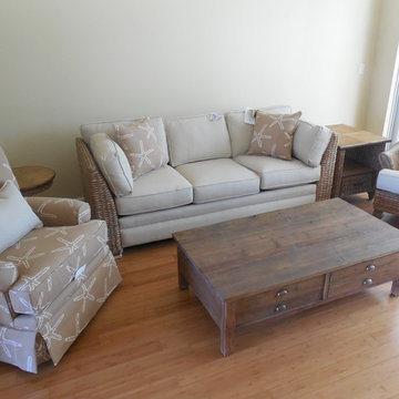 GREY BANANA LEAF SOFA, STARFISH SWIVEL CHAIR, RECLAIMED WOOD COFFEE TABLE