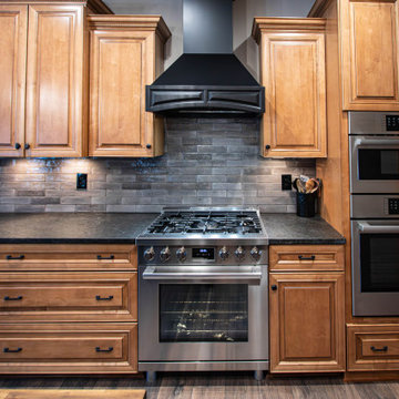 Reconfigured kitchen with new islands, countertops, backsplash