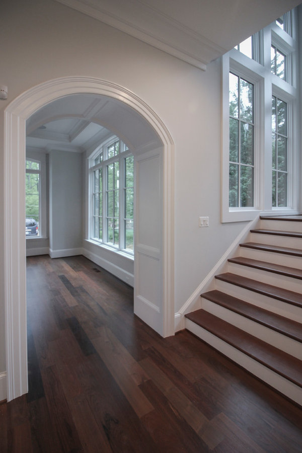 Powerful Impression by Floating Staircase in Suburban Foyer