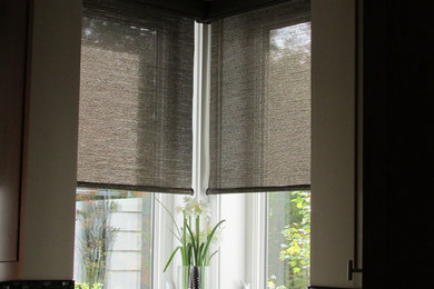 Glare reducing roller shades for kitchen window.