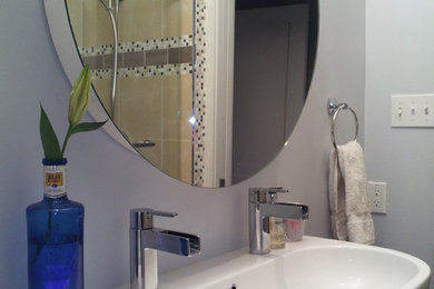 Example of a transitional alcove shower design in Denver with a trough sink, furniture-like cabinets, dark wood cabinets and wood countertops