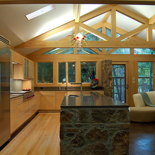 Large craftsman kitchen pantry ideas - Example of a large arts and crafts u-shaped ceramic floor kitchen pantry design in Little Rock with flat-panel cabinets, multicolored backsplash, ceramic backsplash, stainless steel appliances, an island, a single-bowl sink, medium tone wood cabinets and granite countertops