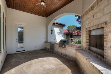 Example of a tuscan patio design in Austin