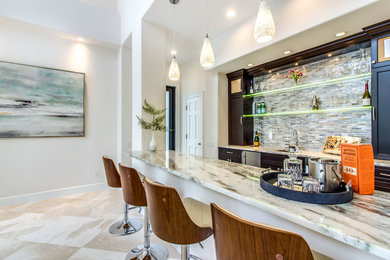 Example of a transitional home bar design in Miami