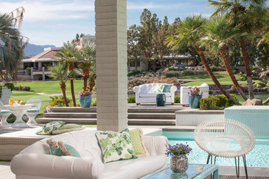 Transitional backyard patio photo in Los Angeles with a pergola