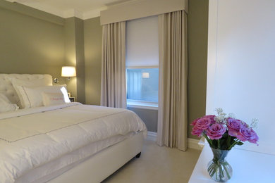 Example of a mid-sized transitional master carpeted and beige floor bedroom design in New York with gray walls and no fireplace