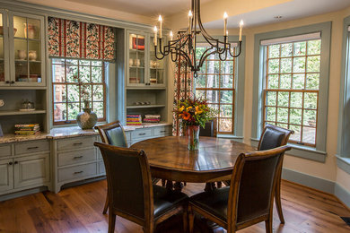 Example of a large classic medium tone wood floor kitchen/dining room combo design in Boston with beige walls and no fireplace