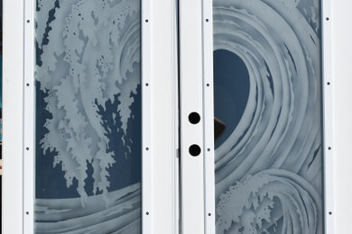 Beach style double front door photo in Tampa