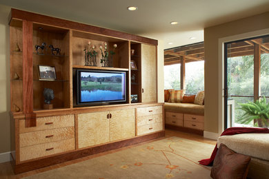 Family room - bamboo floor family room idea in San Francisco with green walls and a media wall