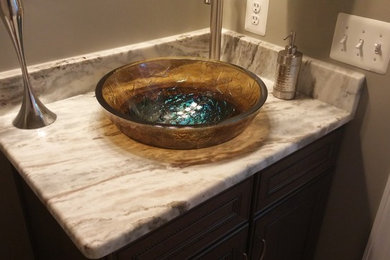Large trendy powder room photo in Baltimore with a vessel sink, flat-panel cabinets, granite countertops, beige walls and brown cabinets