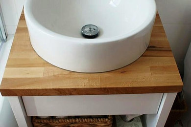 Small transitional master white tile and ceramic tile ceramic tile and blue floor claw-foot bathtub photo in Montreal with flat-panel cabinets, white cabinets, a vessel sink and wood countertops