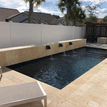 Modern Pool with Water Scuppers in Apopka, Florida