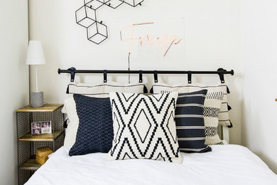 Inspiration for a large scandi master bedroom in Berkshire with white walls, carpet and brown floors.