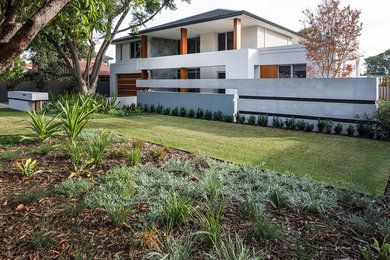 This is an example of a large contemporary front yard full sun garden in Perth.
