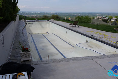 Inspiration for a large contemporary backyard rectangular lap pool in Boise with stamped concrete.