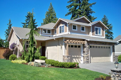 Inspiration for a mid-sized timeless beige two-story mixed siding exterior home remodel in Seattle