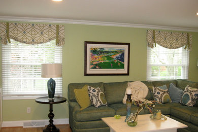 Example of a mid-sized trendy open concept living room design in Columbus with green walls