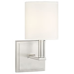 Savoy House - Waverly 1-Light Sconce, Satin Nickel - Chic and contemporary! The Waverly wall sconce is a sleek fixture to add a beautiful, polished layer of light to your home's overall interior lighting design. Plus, the clean lines and soft glow create a subtle and serene mood. The frame has an outlined, square wall plate and a bold, L-shaped light arm, with a brushed, satin nickel finish. A streamlined, cylindrical white shade encloses one 60W, C-style bulb for lovely, glare-free illumination. The Waverly's elegance blends well with many decor styles, such as modern, farmhouse, and transitional. And the sconce measures 5" wide and 11" high, extending 6.5" from the wall an ideal fit for a bathroom, bedroom, dining area, living room, kitchen, family room, foyer, media room, office, or hallway.