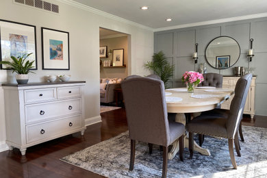 Example of a mid-sized transitional wall paneling kitchen/dining room combo design in Philadelphia with gray walls