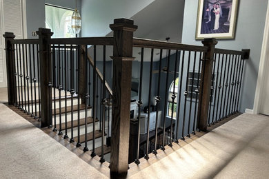 Inspiration for a mid-sized contemporary wooden straight mixed material railing staircase remodel in Tampa with wooden risers