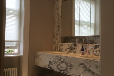 Bathroom, bookmatch marble vanity top, wall & floor cladding and tiling