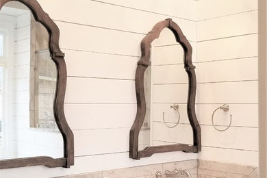 Inspiration for a large country master multicolored tile and porcelain tile porcelain tile and brown floor bathroom remodel in Other with shaker cabinets, white cabinets, gray walls, quartzite countertops, a hinged shower door and white countertops