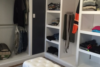 Large cottage chic gender-neutral light wood floor walk-in closet photo in Philadelphia with white cabinets