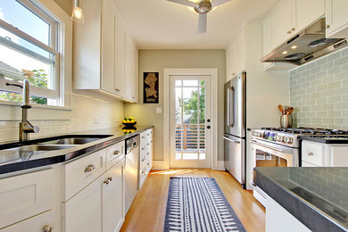 Kitchen - traditional kitchen idea in Seattle with subway tile backsplash
