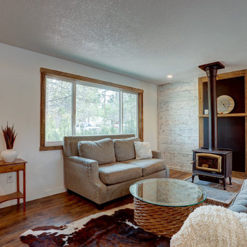 Shabby Chic Farmhouse Living Room with Fireplace and Barnwood Features
