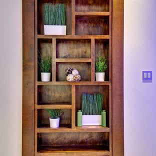 Design ideas for a large contemporary look-out basement in Denver with white walls, carpet, no fireplace and white floors.