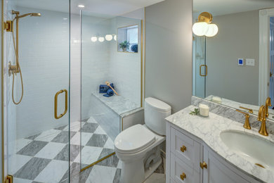 Bathroom - mid-sized traditional 3/4 white tile and ceramic tile marble floor, multicolored floor and single-sink bathroom idea with white cabinets, gray walls, marble countertops, a hinged shower door, white countertops, a built-in vanity, an undermount sink, shaker cabinets and a two-piece toilet