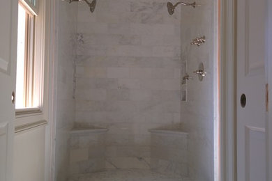 Photo of a large traditional master bathroom in New Orleans with a freestanding tub, an open shower, white tile, stone tile, white walls and marble floors.
