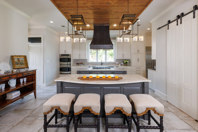 Example of a transitional kitchen design in New Orleans