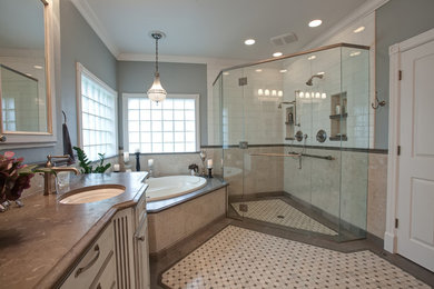 Bathroom - large traditional master beige tile and stone tile mosaic tile floor bathroom idea in Other with an undermount sink, raised-panel cabinets, distressed cabinets, a two-piece toilet and blue walls