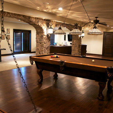 Basement with Curved Bar and Entertainment Areas