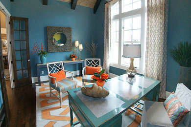 Study room - large eclectic freestanding desk dark wood floor study room idea in Kansas City with blue walls