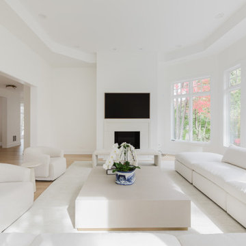 Glencoe Minimalist Lounge With Tailored Sectional and Bright Bay Window Views