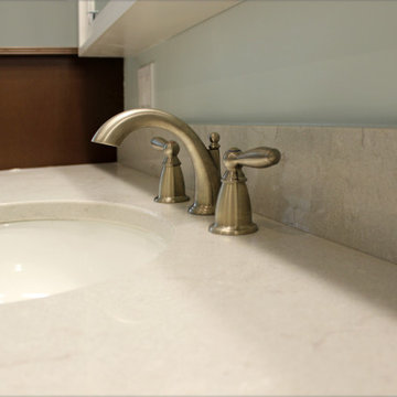 Warm Gray Vanity with Maple Truffle Accent Linen Cabinet and Tiled Shower