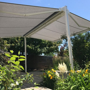 Free standing, dual-retracting awning