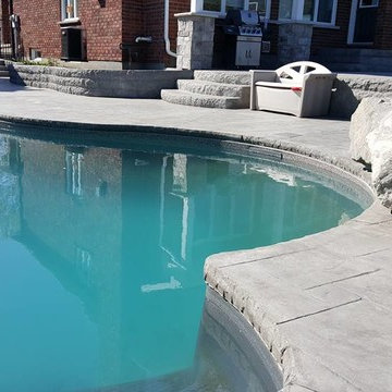 Pool deck with retaining walls & cantilever coping.